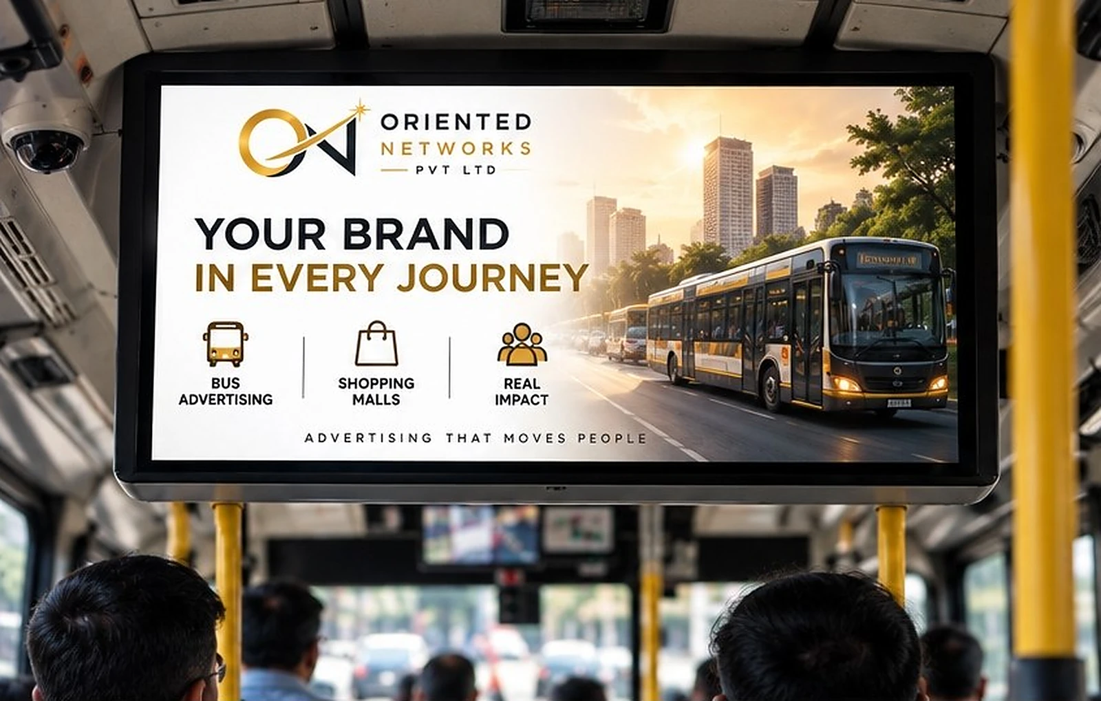 A close view of an HD bus screen playing an Oriented Networks advertisement, with passengers' heads below it